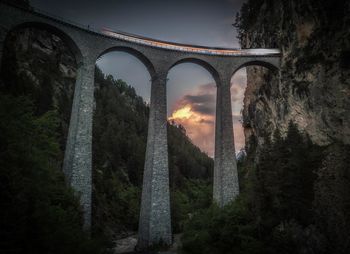Arch bridge against sky