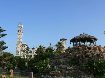 Low angle view of historical building against clear blue sky