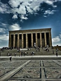 Group of people in front of historical building