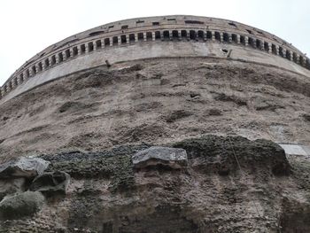 Low angle view of old building against sky