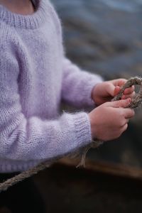 Cute baby hands in a warm sweater