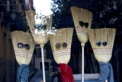 Brooms with sun glasses - shop window