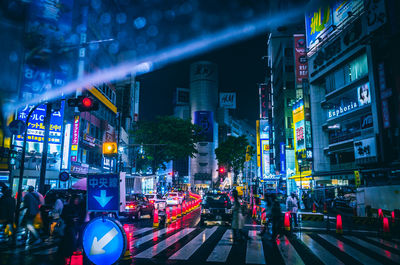 View of traffic on city street at night