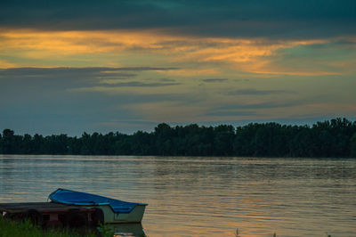 Boat moored on danube river at susnet