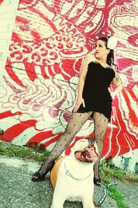 Portrait of young woman with cat