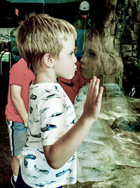 Portrait of a boy holding water