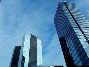 Low angle view of modern buildings against sky