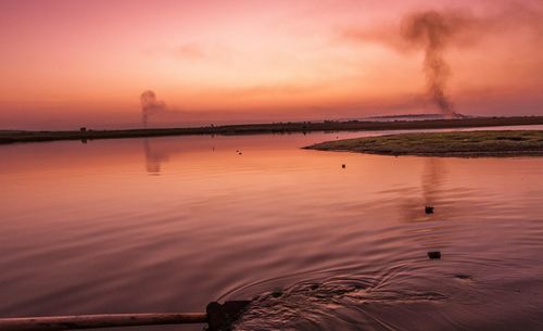 Scenic view of sea against sky at sunset