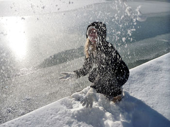 Person with dog in water