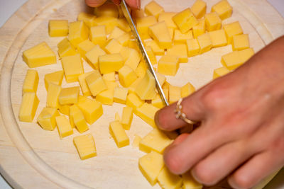 High angle view of man preparing food on cutting board