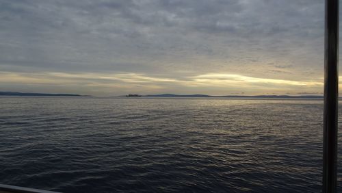 Scenic view of sea against sky at sunset