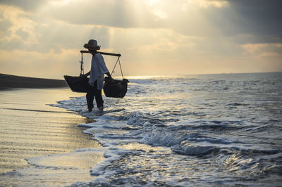 Lone boat in sea against sky