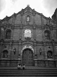 Facade of historic building against sky