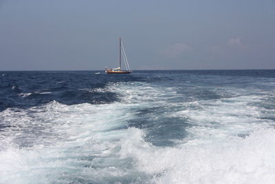 Ship in the waves of the water of the mediterranean sea in balearic islands