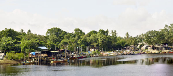 Boats moored on river in malaysia