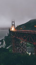 View of suspension bridge over sea