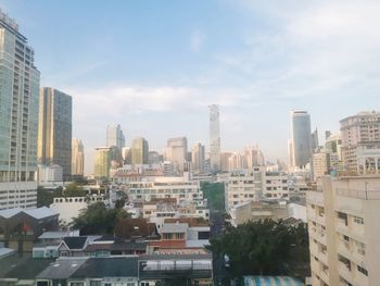 Modern buildings in city against sky
