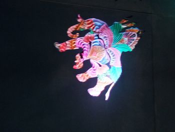 Close-up of art over black background