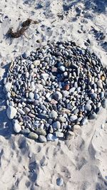 High angle view of pebbles on beach