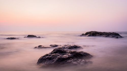 Scenic view of sea against sky at sunset