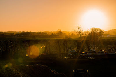 Close-up of fountain against sky during sunset