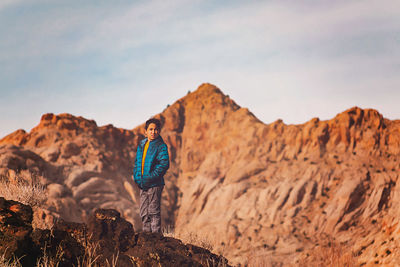 Boy hiking in state park in utah in the winter