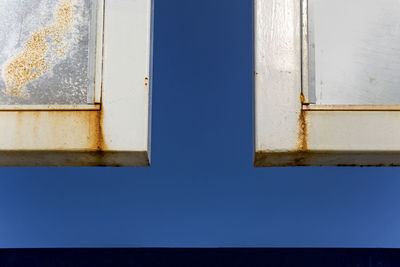 Low angle view of building against clear blue sky