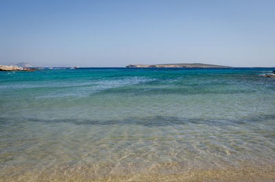 Scenic view of sea against clear blue sky