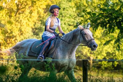 Woman riding horse