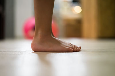 Children's bare feet. child's bare feet on the wooden floor