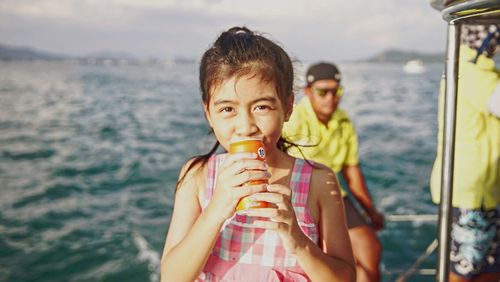 Portrait of young woman in water