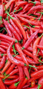 Full frame shot of red chili peppers for sale at market