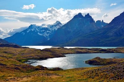 Scenic view of lake and mountains against sky