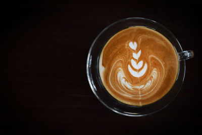 Close-up of cappuccino on table