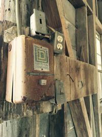 Close-up of rusty fuse box in abandoned house