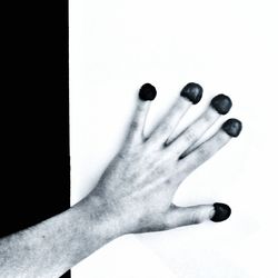 Low section of woman against white background