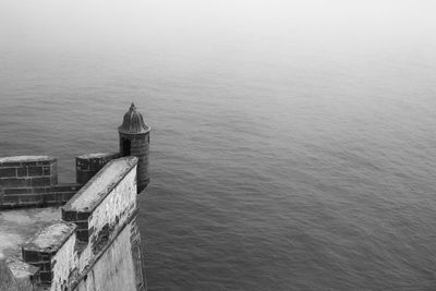 High angle view of building by sea against sky