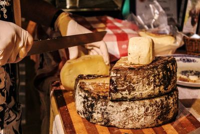 Close-up of hand with pecorino cheese