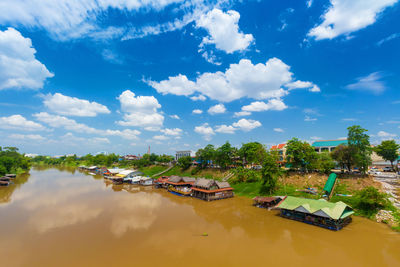 Panoramic view of buildings and trees against sky