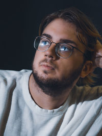 Close up portrait of a young bearded man face