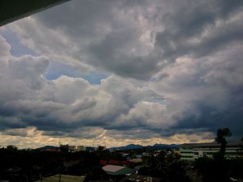 Storm clouds over city buildings