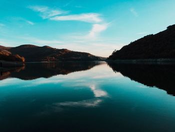 Scenic view of lake against blue sky