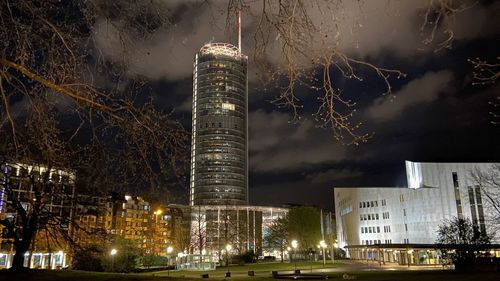 Illuminated buildings in city at night