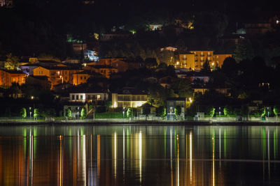 Reflection of illuminated buildings in water