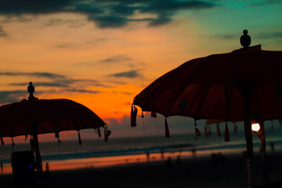 Seminyak beach sunset view with umbrella