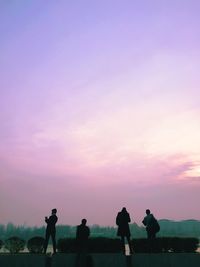 Silhouette people walking on landscape