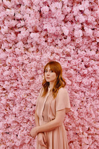 Young woman standing on field