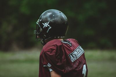 Rear view of man standing on field