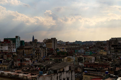 Cityscape against sky during sunset