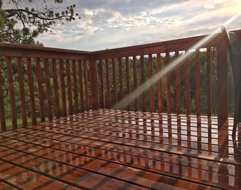 Wooden railing against sky